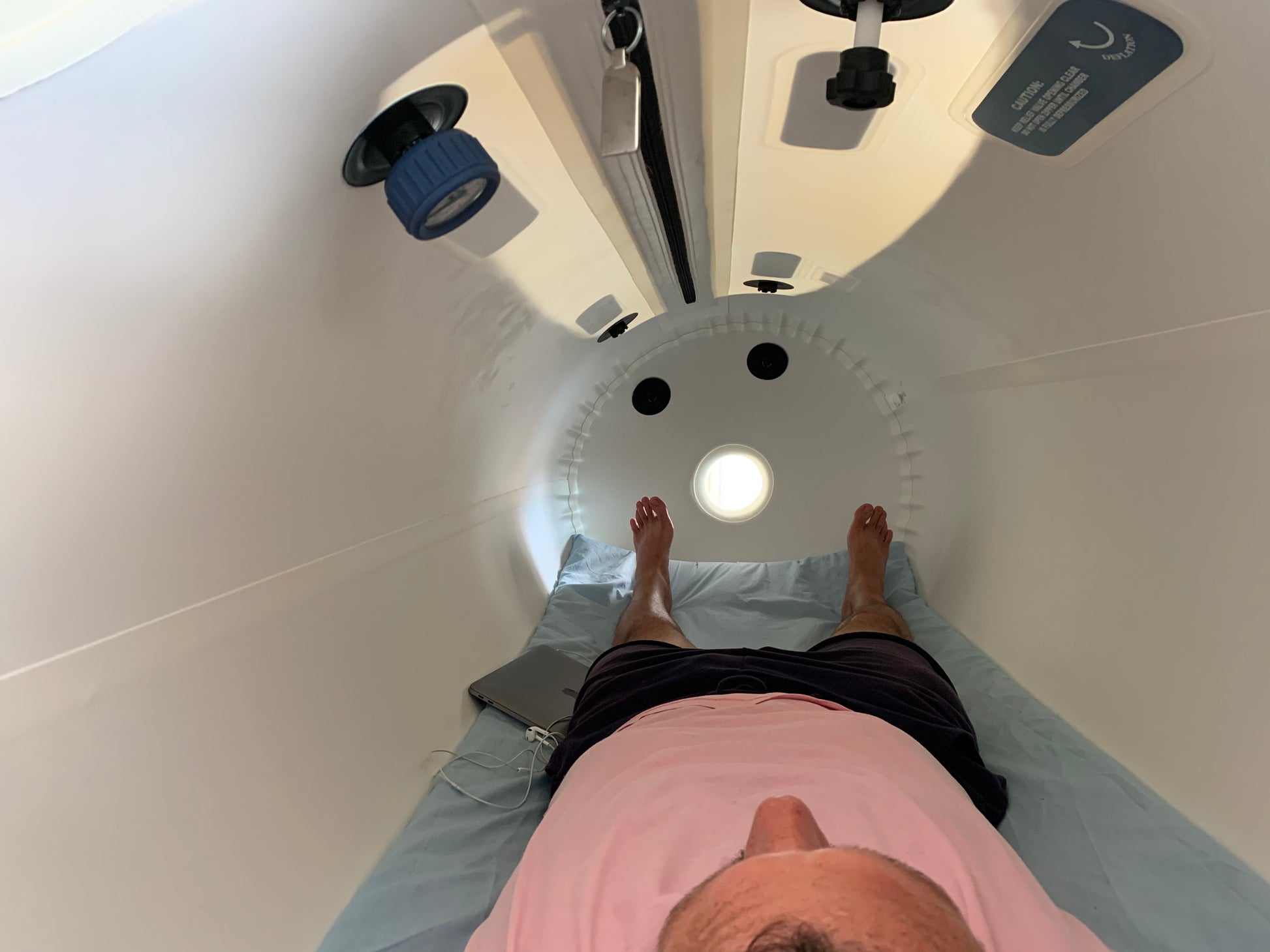 Person inside Zerava Hyperbaric Chamber