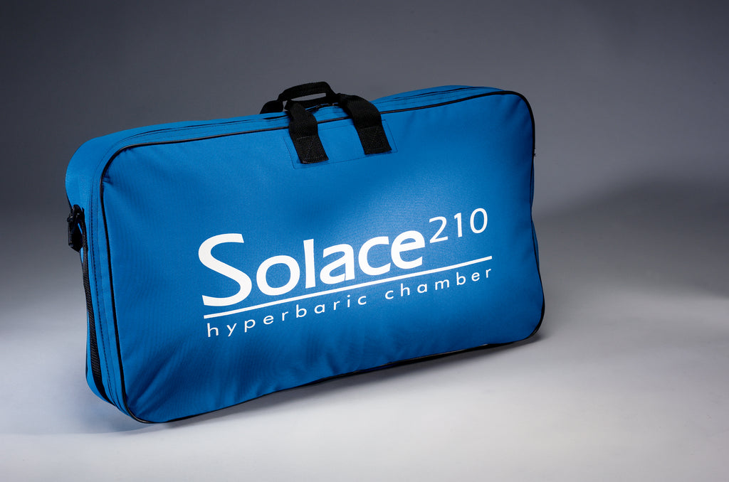 Blue carrying case for Solace 210 hyperbaric chamber on a gray background