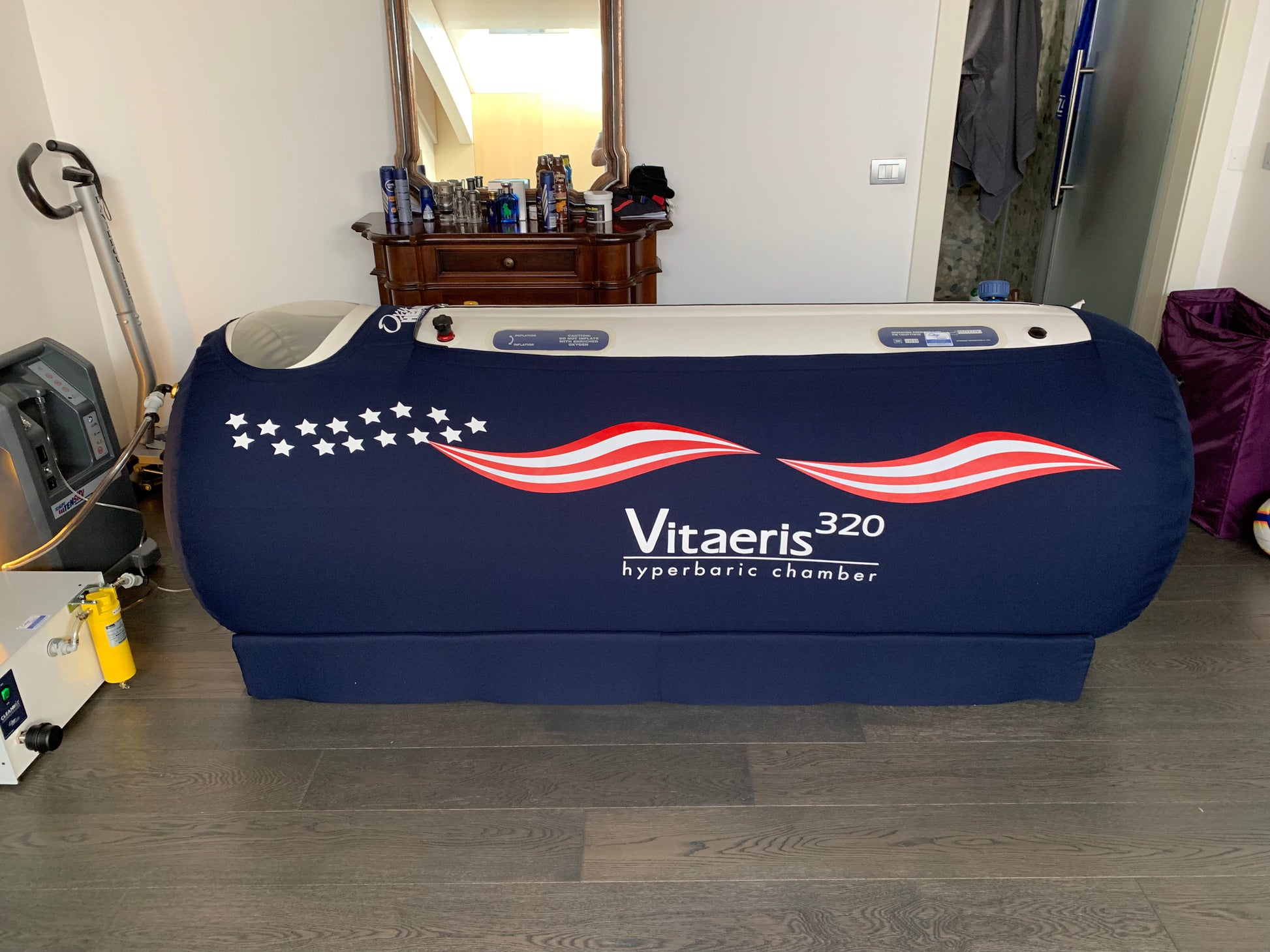 Vitaeris hyperbaric chamber in a room with furniture and equipment.