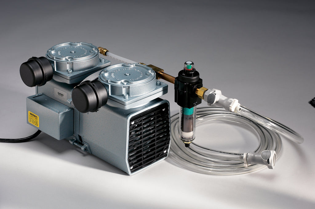Pump with hoses and connectors on a gray background
