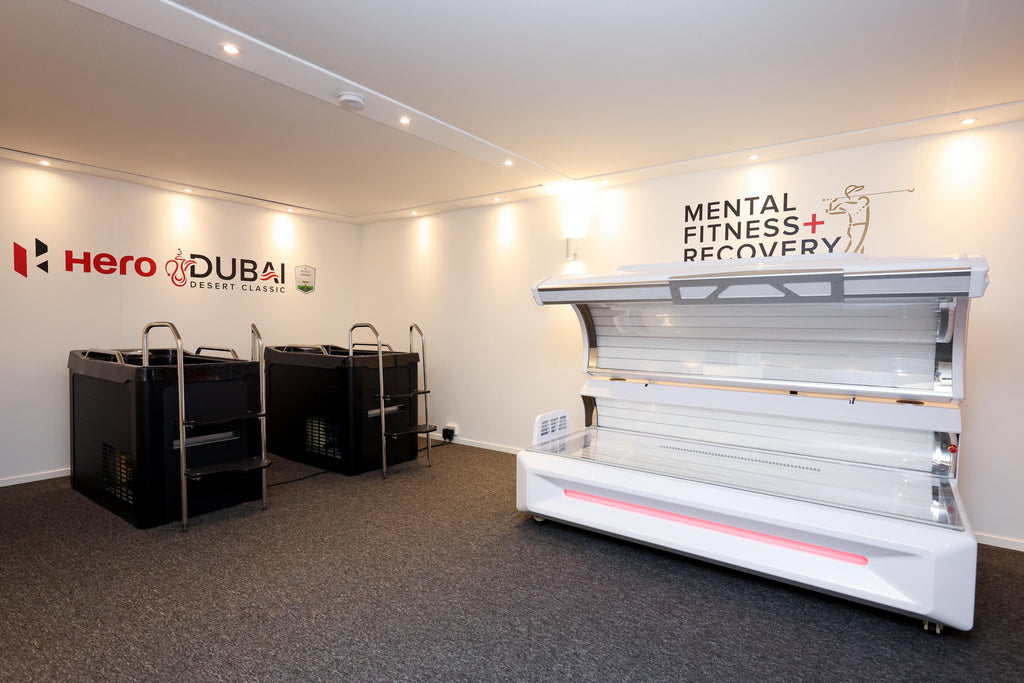 Zerava Redlight  bed in a room with 'Hero Dubai' and 'Mental Fitness Recovery' branding on the wall.