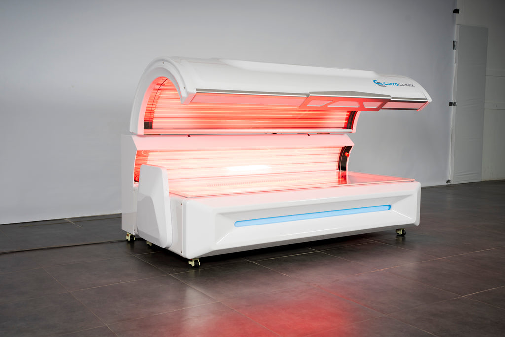 Zerava White tanning bed with red and blue lights on a gray floor.