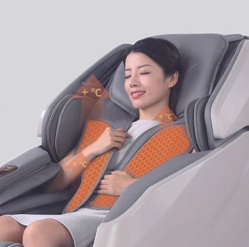 Woman using a Zerava massage chair with an orange cushion on a light gray background