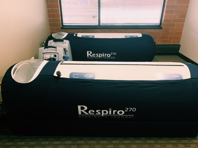 Two Respiro 270 hydrotherapy chambers in a room with a window.